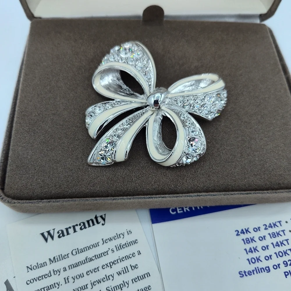 Vintage NIB Nolan Miller Silver-tone Bow Brooch With Rhinestones